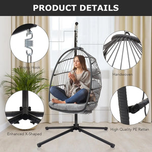 Woman relaxing in a handwoven grey PE rattan hanging egg chair with strong hook and X-shaped base