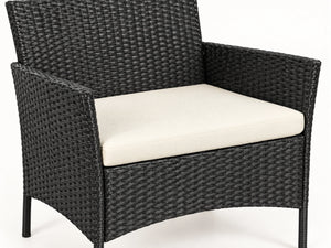 Cream seat cushion on black rattan garden seating