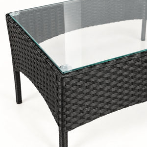 Glass-top rattan coffee table with an open frame underneath