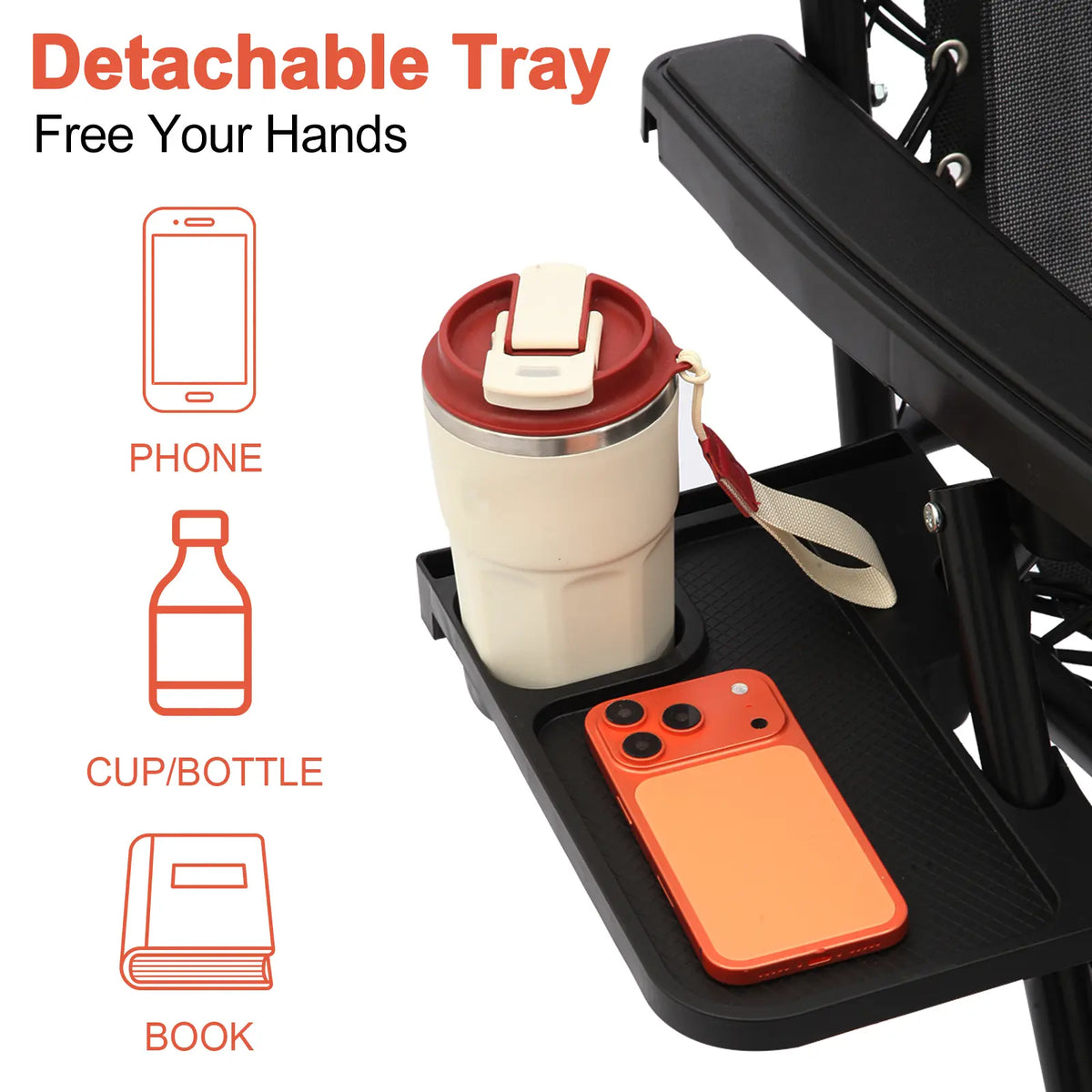 Detachable side tray attached to a black zero-gravity reclining chair, holding a phone, cup and book